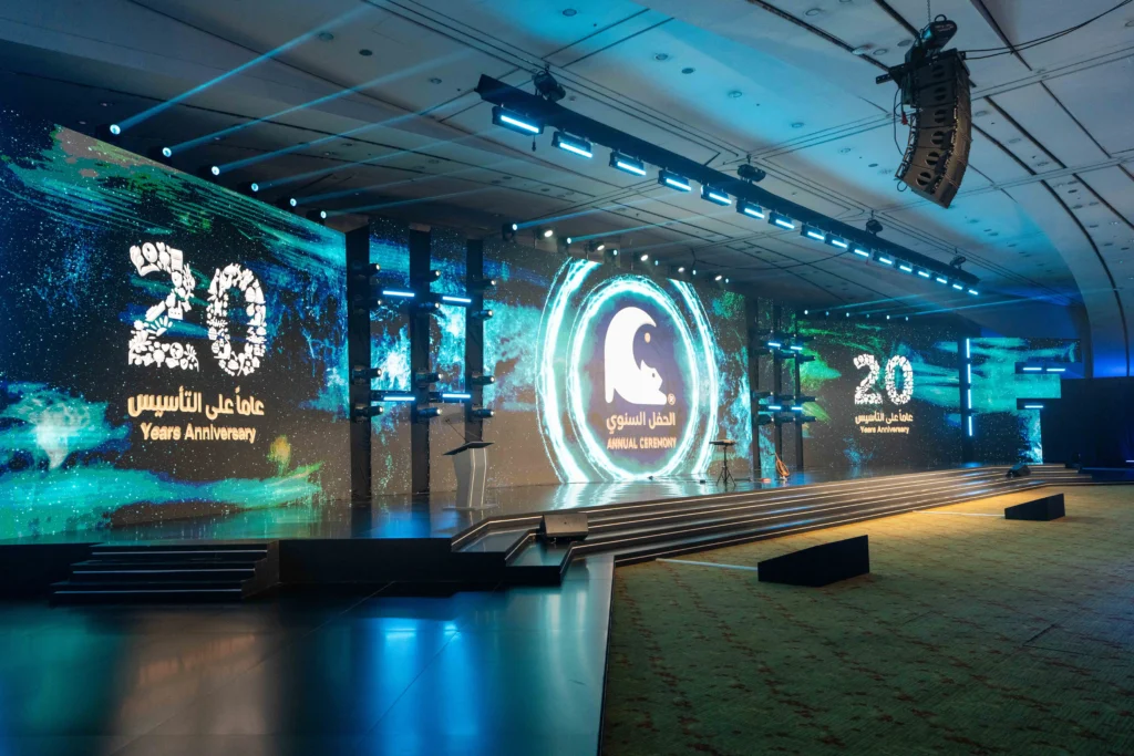 Wide-angle view of the stage setup with LED screens and gala seating for the annual ceremony.
