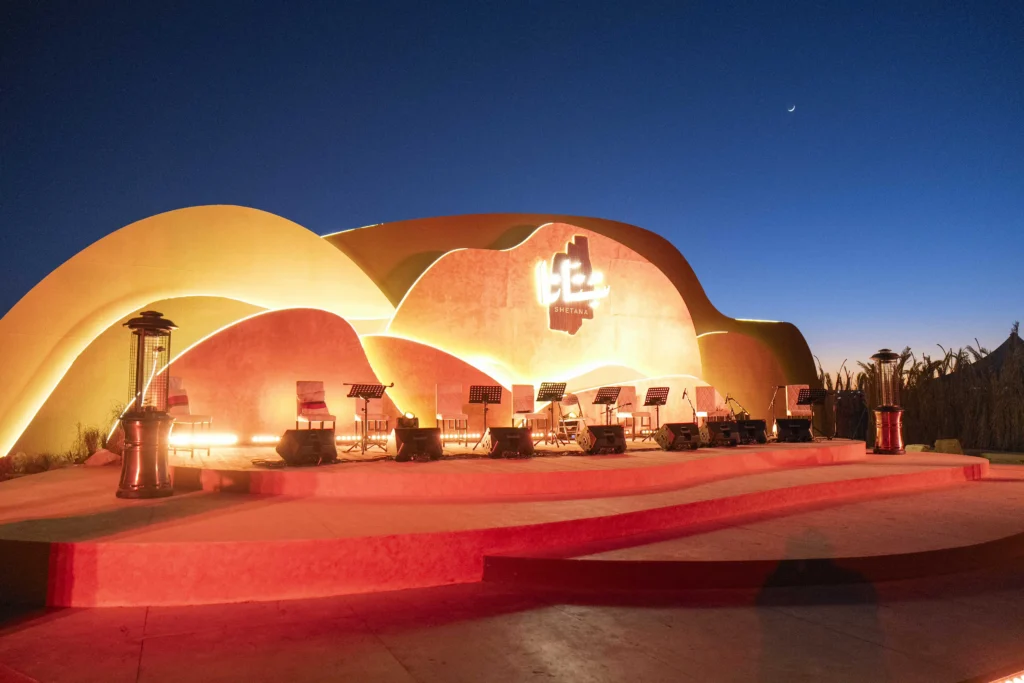 Expansive canopy at Al Dariyah lit with warm evening lights, covering the entire event area.