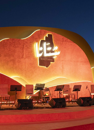 Expansive canopy at Al Dariyah lit with warm evening lights, covering the entire event area.